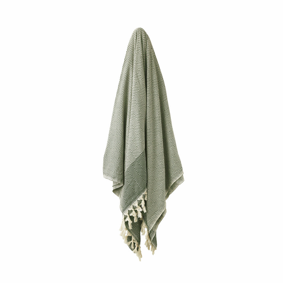 Forest Green and Beige Turkish Dream blanket hanging with stripe and diamond shape patterns