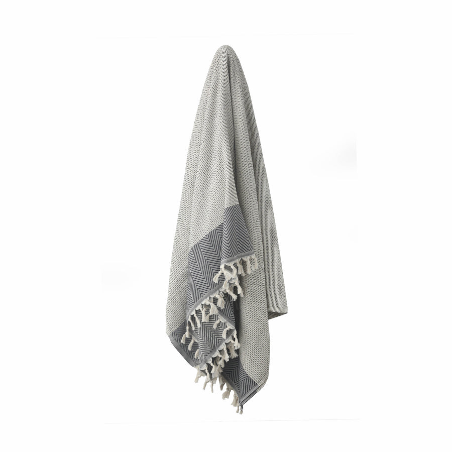 Beige Turkish Dream blanket hanging with stripe and diamond shape patterns