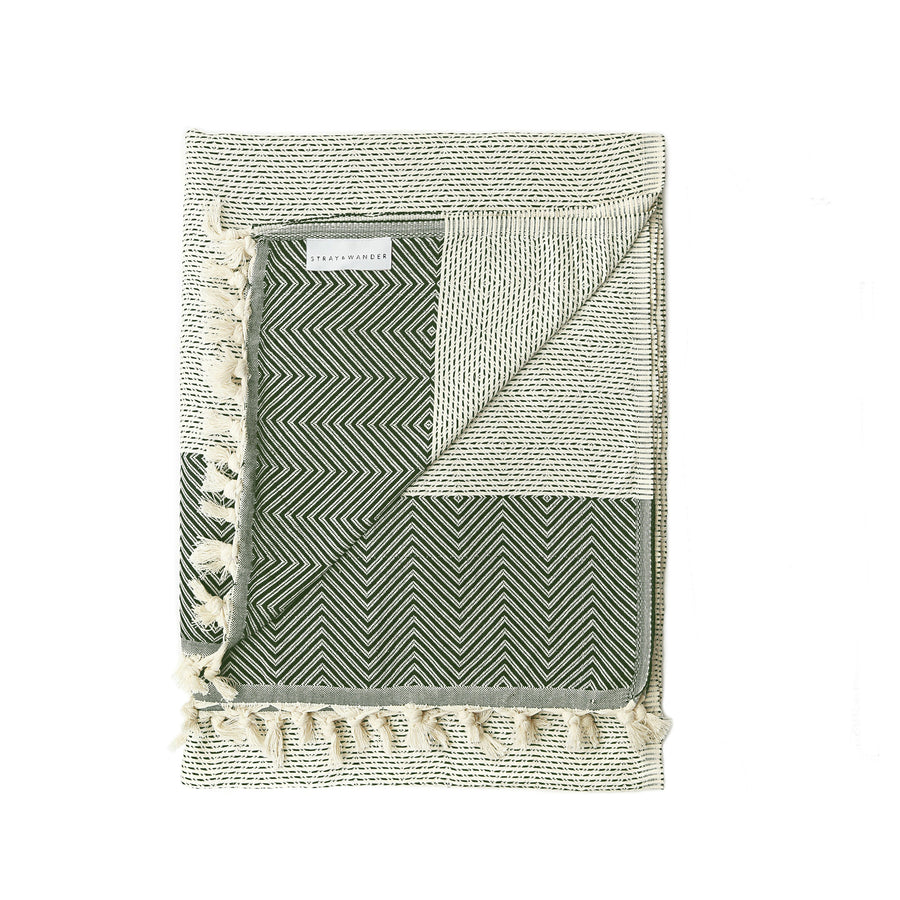 Beige and Dark Green Black Turkish Dream blanket folded with stripe and diamond shape patterns