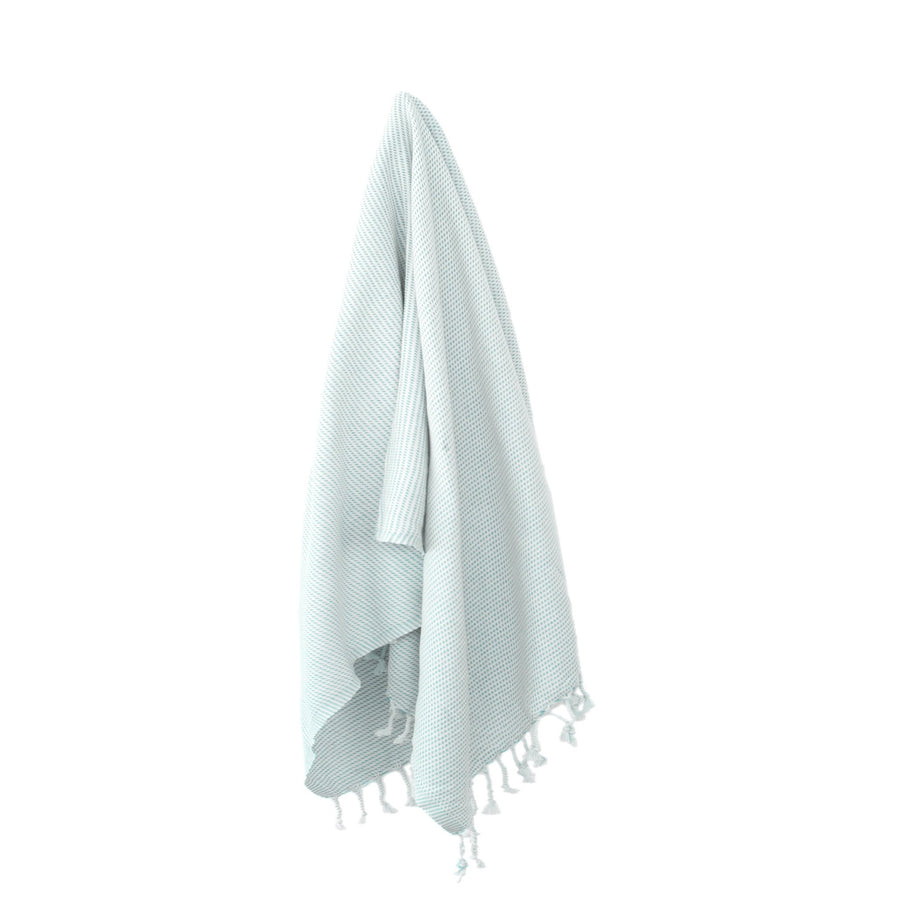 Organic Turkish Kai blue glow towel hanging