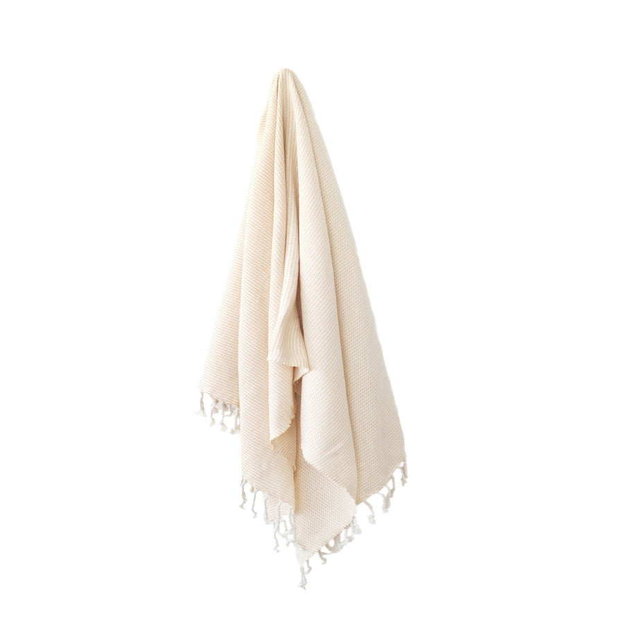 Organic Turkish Kai tangerine towel hanging