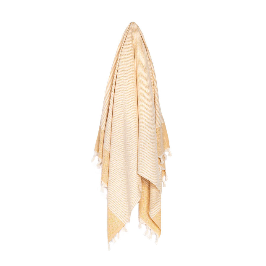Organic Turkish Repose mustard towel hanging